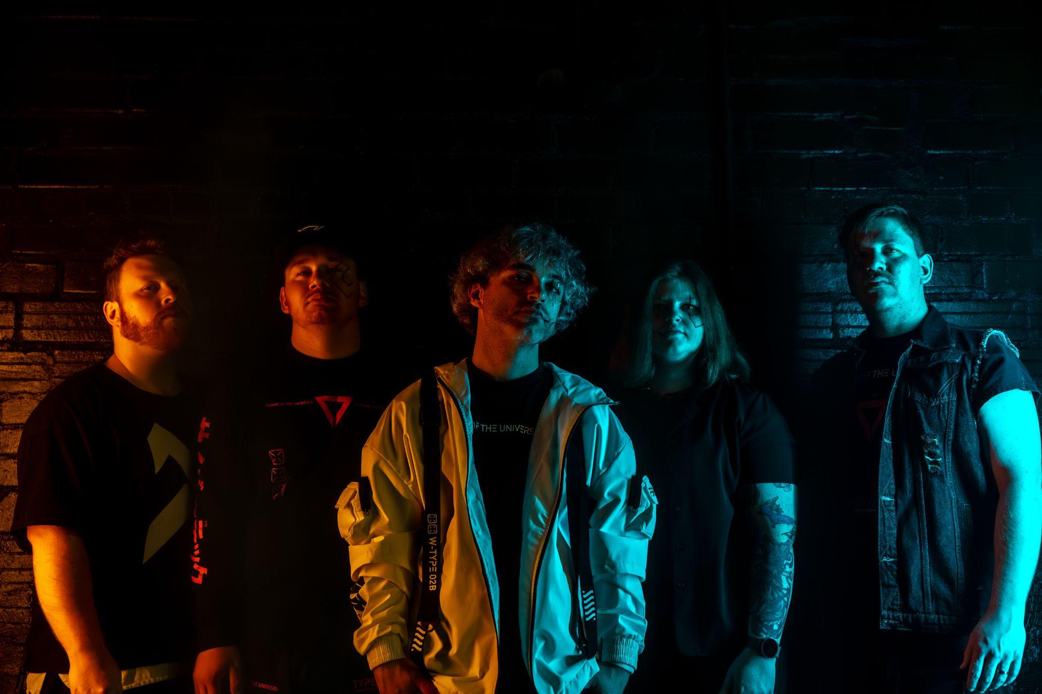All five members of Turning Tydes, with Nathan Hall in the center